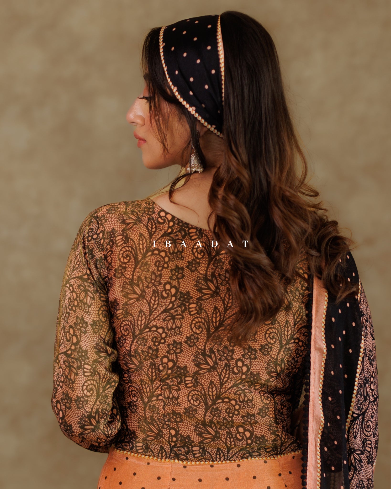 Exquisite peach Punjabi suit with delicate lacework and embroidery