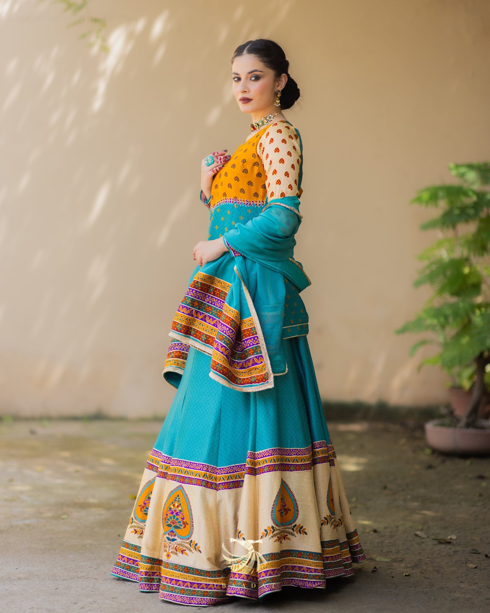 Festive wear turquoise silk Anarkali dress for weddings