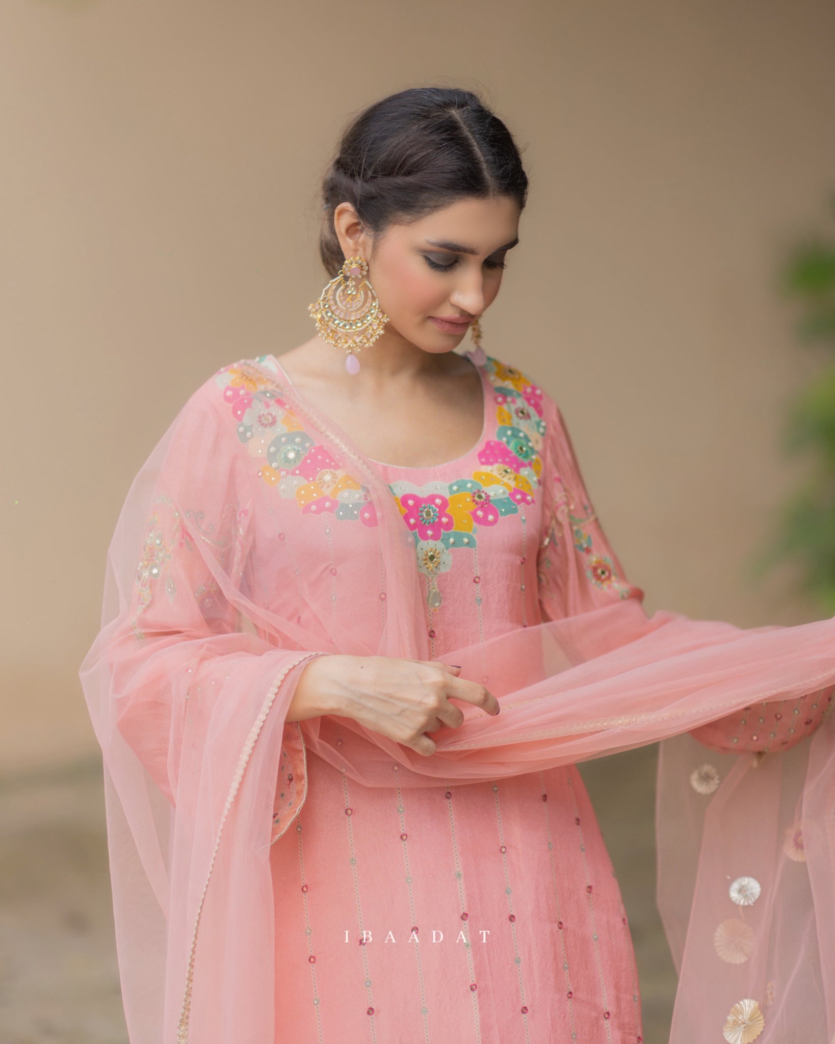 Pastel pink organza Punjabi salwar suit with embroidered net dupatta
