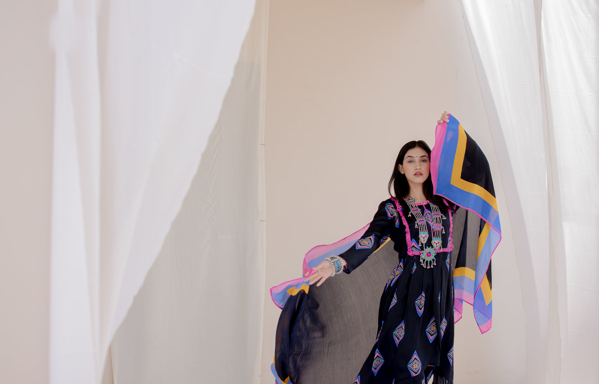 Black Punjabi salwar suit with white detailing and organza fabric