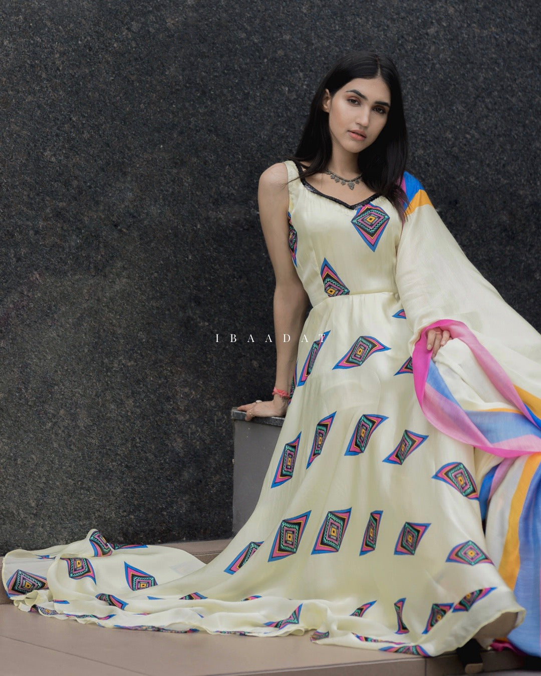Close-up of white print on black Punjabi satin suit