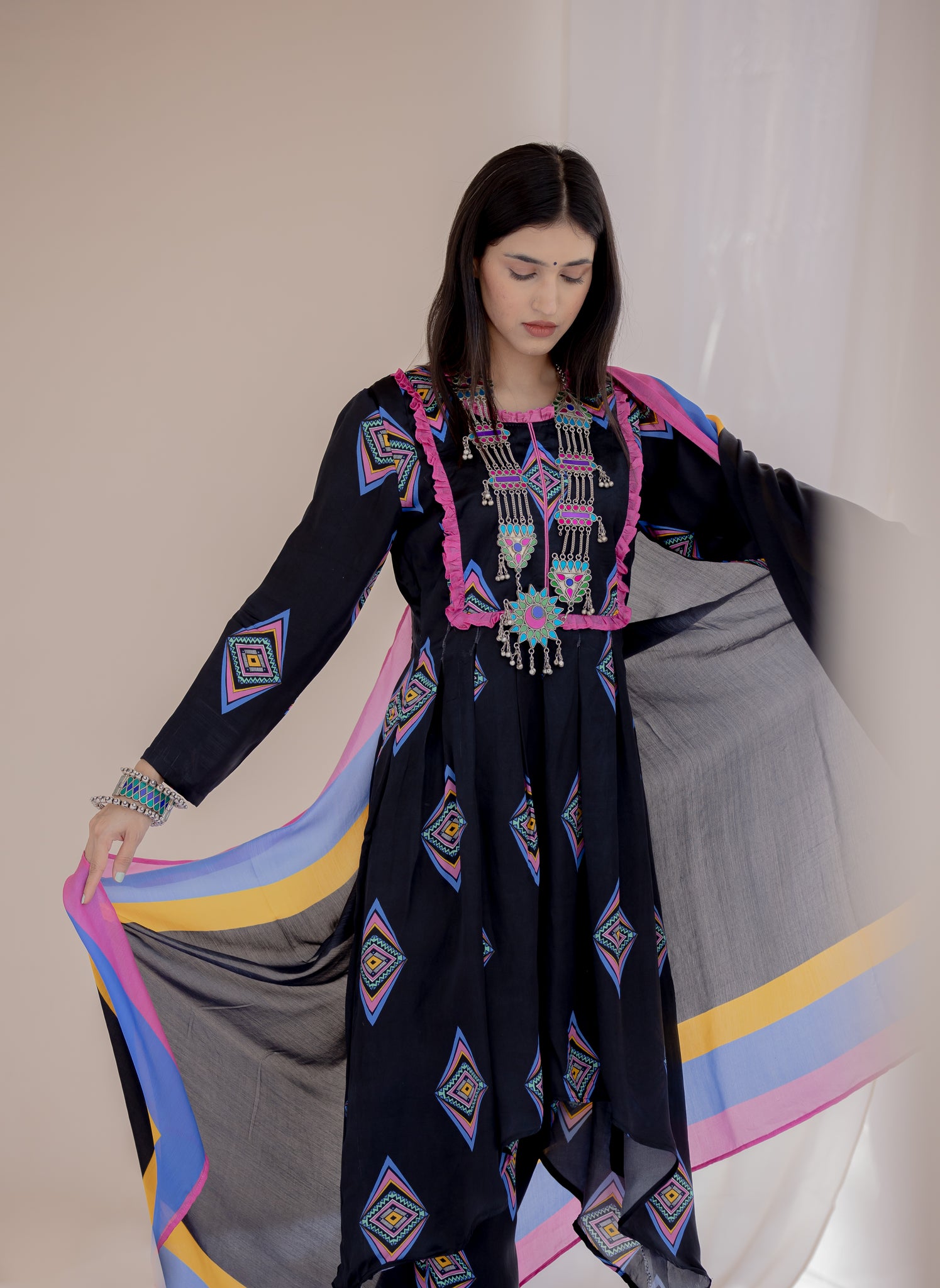 Formal black Patola suit for women – office & festive wear