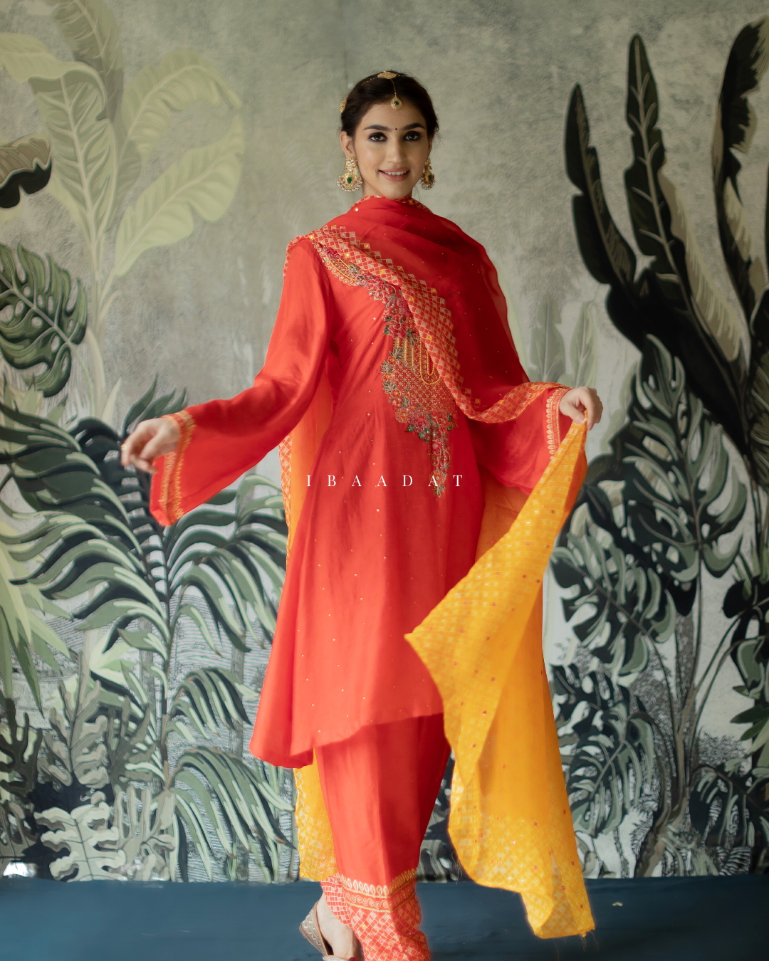 Traditional red Rani salwar suit with hand embroidery